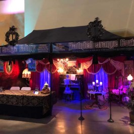 a person standing next to a fireplace