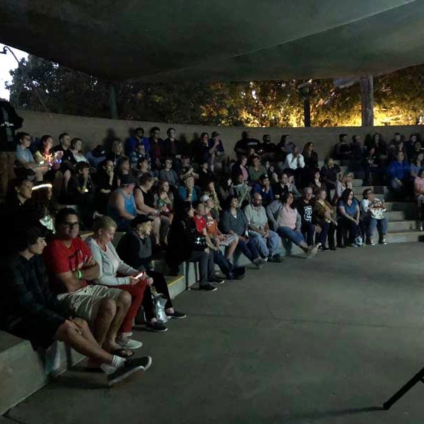 a group of people standing in front of a crowd