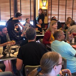 a group of people sitting at a table