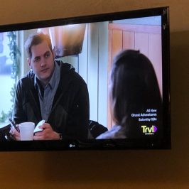 Ben Hansen standing in front of a flat screen television