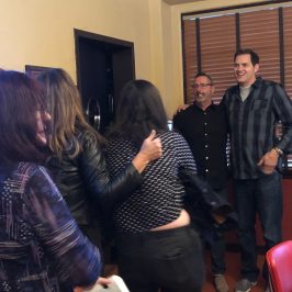 Ben Hansen et al. standing in a room