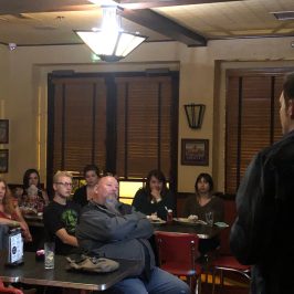 a group of people sitting at a table