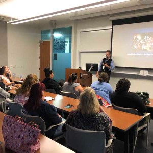 a group of people sitting at a table in a room