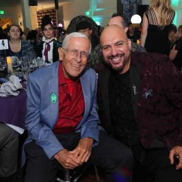 Bob Gurr et al. sitting posing for the camera