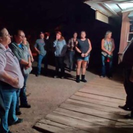 a group of people standing in front of a crowd