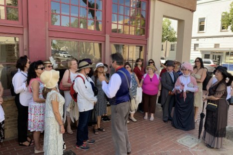 a group of people standing in front of a building