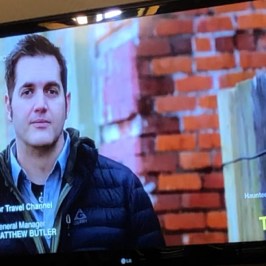 Ben Hansen standing in front of a flat screen television