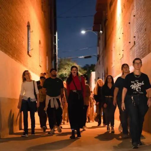 a group of people standing in front of a building