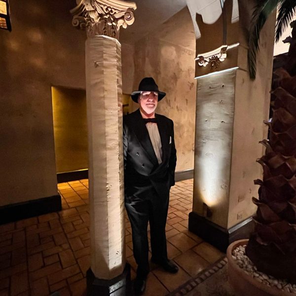 a man standing in front of a building