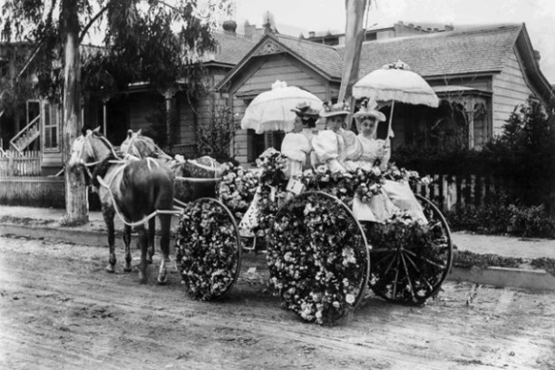 a close up of a horse drawn carriage in front of a building