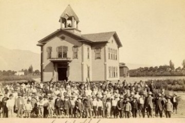 a group of people standing in front of a building